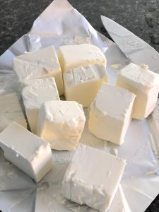 Cut a block of cream cheese into cubes